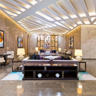 nicely decorated room with wooden ceiling